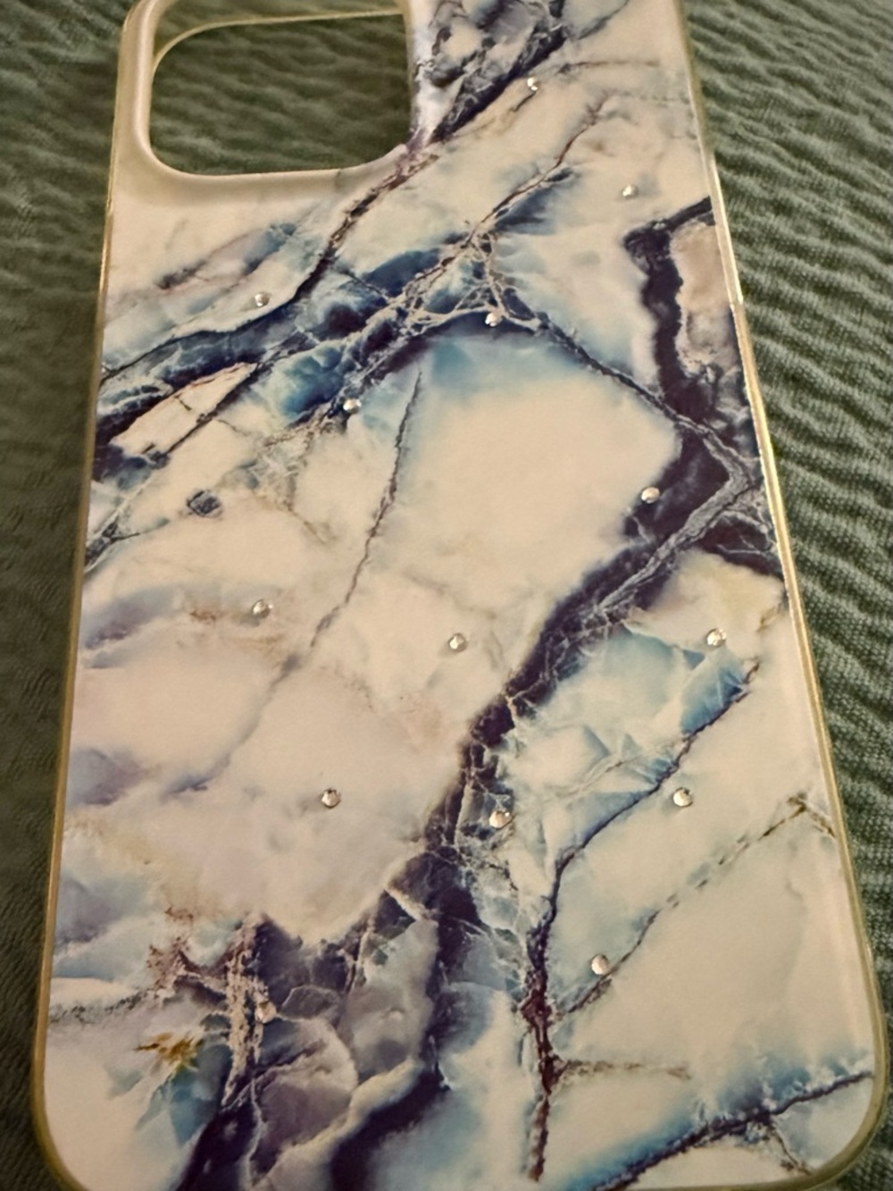 Stylish Blue Marble Phone Case with Rhinestone Accents. 13 Pro Max